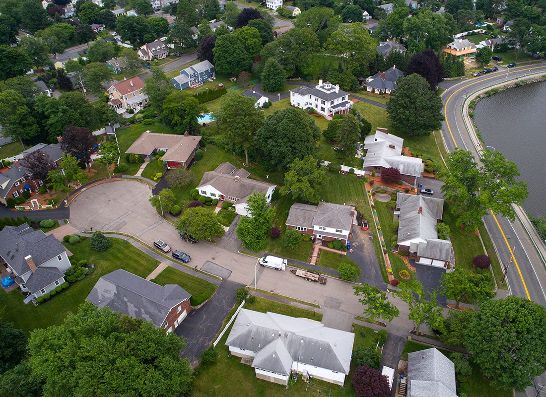 Contact - Aerial View of a Group of Homes and Trees in Massachusetts